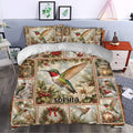 Christmas hummingbird duvet cover set styled in a bedroom with poinsettias, lanterns, berries, and greenery