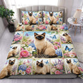 Siamese cat duvet cover set displayed on a bed with colorful flowers, butterflies, and garden-inspired artwork