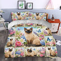 Siamese cat duvet cover set styled in a bedroom with colorful flowers, butterflies, and cottage garden decor