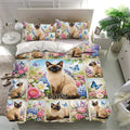 Floral Siamese cat bedding set presented in a bright bedroom with matching pillowcases and colorful garden artwork