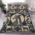 Greyhound duvet cover set displayed on a bed with navy, beige, and geometric patchwork artwork