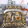 Greyhound duvet cover set styled in a bedroom with sunflower accents and coordinated patchwork pillowcases