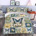Butterfly duvet cover set styled in a bedroom with blue, green, yellow, and white floral artwork