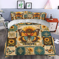 Butterfly and sunflower bedding set styled on a bedroom bed with teal, gold, and orange accents