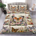 Butterfly duvet cover set displayed on a bed with floral panels and colorful garden artwork