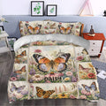Butterfly bedding styled in a bedroom with large orange wings, flowers, and garden-inspired panels