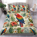 Colorful parrot duvet cover displayed on a bed with tropical leaves, hibiscus flowers, and matching pillowcases