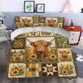 Highland cow bedding with sunflower patchwork design styled in a cozy bedroom