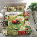 Ladybug bedding set presented in a bright bedroom with matching pillowcases and detailed floral patchwork