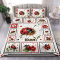 Ladybug duvet cover set displayed on a bed with daisies, floral panels, and red and black accents