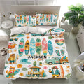 Tropical surfing bedding set displayed on a modern bed with surfboards, palm trees, waves, and coastal artwork