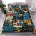 Bicycle duvet cover set displayed on a bed with vintage cycling, mountain, and bicycle blueprint artwork