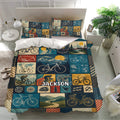 Bicycle bedding set in a bright bedroom featuring vintage bike illustrations, cycling gear, and scenic mountain panels