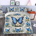 Blue butterfly duvet cover styled in a bright bedroom with matching floral pillowcases