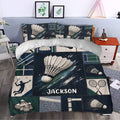Badminton duvet cover bedding set styled in a modern bedroom with navy, green, and white artwork