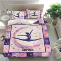 Gymnastics bedding set in a bright bedroom featuring a leaping gymnast, pastel pink and purple watercolor accents, and stars