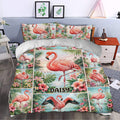 Flamingo duvet cover styled in a bedroom with pink birds, hibiscus flowers, palm leaves, and coastal scenery