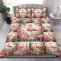 Flamingo duvet cover set displayed on a bed with pink flowers, tropical foliage, and coordinated pillowcases