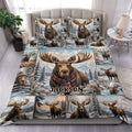 Moose duvet cover set displayed on a bed with snowy mountain scenery and rustic wildlife artwork