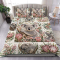 Koala duvet cover set displayed on a bedroom bed with floral Australian wildlife artwork