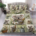 Koala duvet cover set displayed on a bed with daisies, greenery, butterflies, and cottage garden details