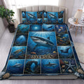 Shark duvet cover set displayed on a bed with blue underwater scenes, coral, fish, turtles, and manta rays