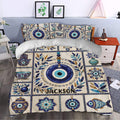 Evil eye duvet cover styled in a bedroom with blue botanical details, protective symbols, and decorative motifs