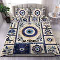 Blue and gold evil eye duvet cover set styled on a bedroom bed with matching printed pillowcases