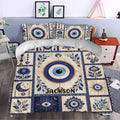 Blue evil eye bedding set styled in a bedroom with celestial symbols, flowers, and ornate borders