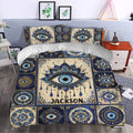 Evil Eye duvet cover bedding in a bedroom with navy, cream, gold, and turquoise mandala-style eyes
