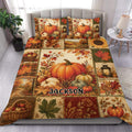 Autumn pumpkin duvet cover bedding set displayed on a bed with harvest patchwork, leaves, lanterns, and warm rustic colors