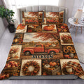 Autumn duvet cover set displayed on a bed with pickup truck, pumpkins, sunflowers, and falling leaves