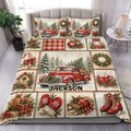Christmas duvet cover set displayed on a bed with vintage red truck, wreath, pine tree, and holiday patchwork design