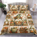 Autumn gnome duvet cover set displayed on a bed with pumpkins, mushrooms, leaves, cottages, and harvest details