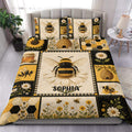 Bee duvet cover set displayed on a bed with honeycomb, beehive, daisy, and sunflower artwork