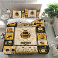 Bee bedding set styled in a bright bedroom with honeybee, daisy, sunflower, and honeycomb artwork