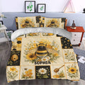 Bee duvet cover set styled in a bedroom with honeycomb panels, flowers, beehive, and honey dipper artwork