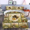 Bee bedding set styled in a bedroom with large bees, daisies, birdhouses, and colorful garden scenes