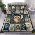 Owl duvet cover set displayed on a bed with moonlit woodland artwork in navy, cream, and blue tones