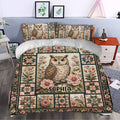 Owl duvet cover bedding styled in a bedroom with vintage floral patchwork artwork