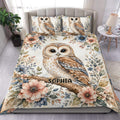 Owl duvet cover set with floral branches and a large illustrated owl displayed on a bedroom bed