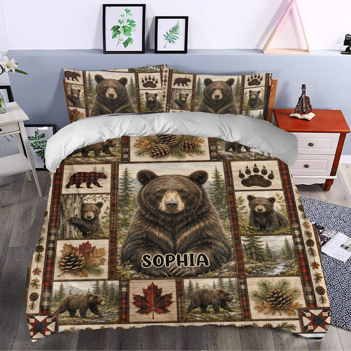 Rustic bear bedding set styled in a bedroom with woodland artwork, pinecones, leaves, and forest landscape panels