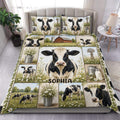 Dairy cow duvet cover set displayed on a bed with farmhouse scenes, daisies, milk cans, and a barn