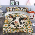 Dairy cow bedding set styled in a bedroom with matching floral pillowcases and farmhouse-inspired decor