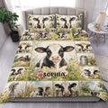 Dairy cow duvet cover set displayed on a bed with floral farm scenes and a large central cow portrait