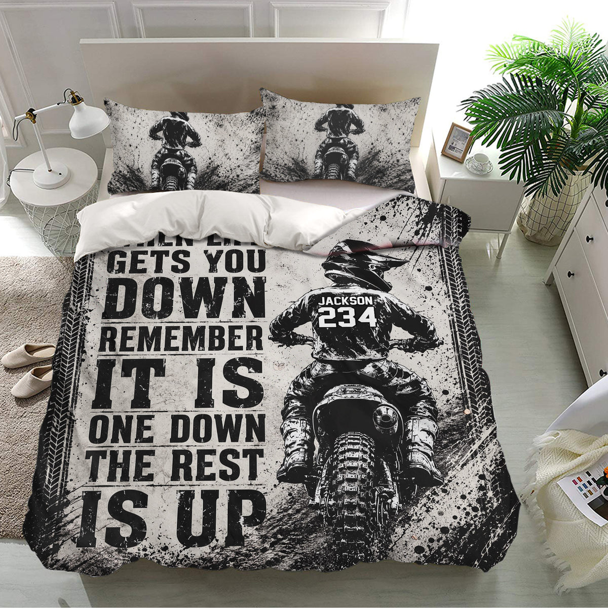 Black-and-white motocross duvet cover set displayed on a modern bedroom with dirt bike artwork