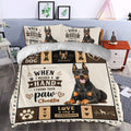 Doberman duvet cover bedding set styled in a bedroom with a large dog portrait, paw prints, bones, and hearts