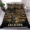 Deer duvet cover set displayed on a bed with rustic flag-inspired stripes, stars, antlers and wildlife artwork