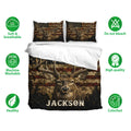 Rustic deer bedding set shown with matching pillowcases and bold antler artwork in black, brown and muted red