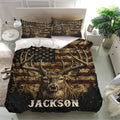 Deer bedding set displayed in a bright bedroom with matching pillowcases and a large antler wildlife design